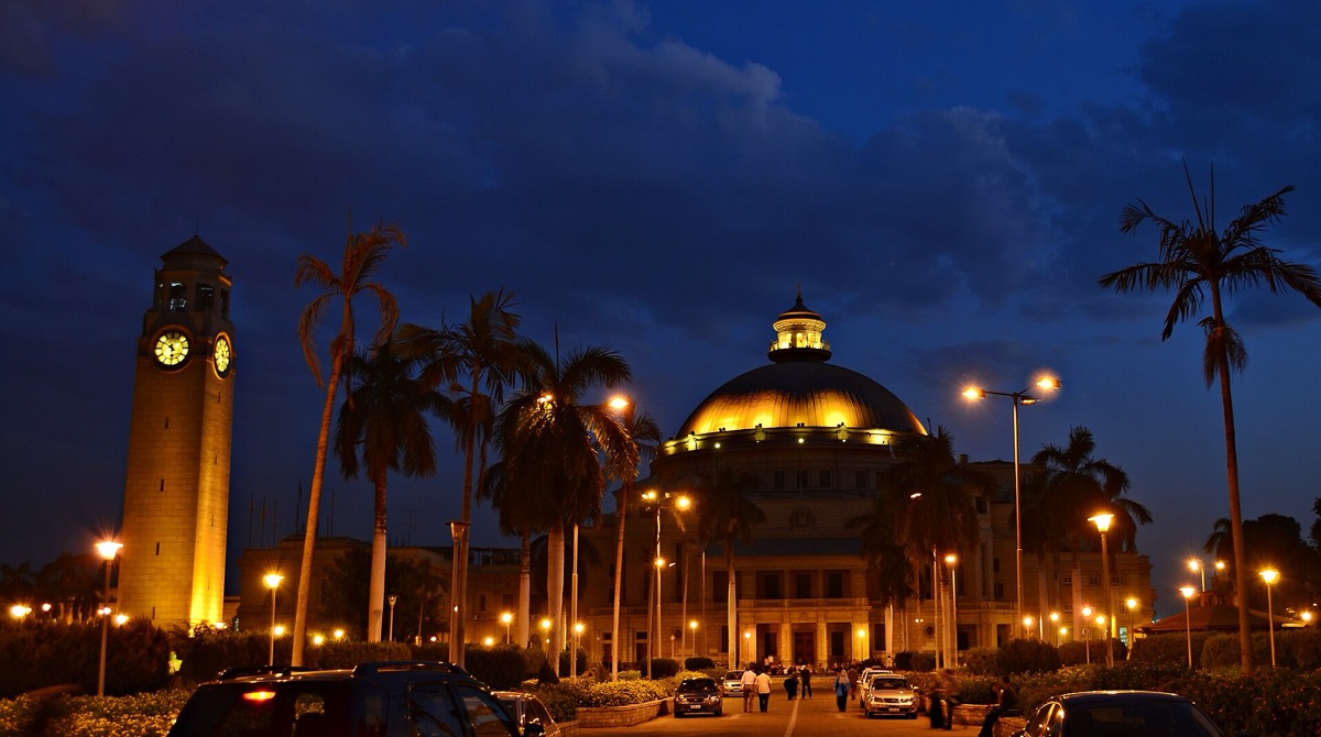 Cairo University’s dome and clock tower lit at night